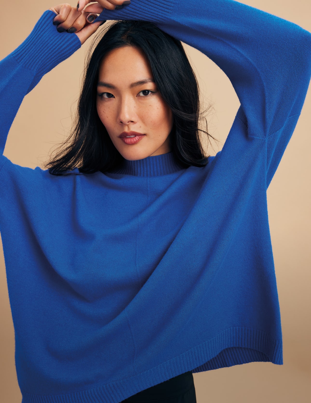 Woman wearing Phase Eight Blue Jumper