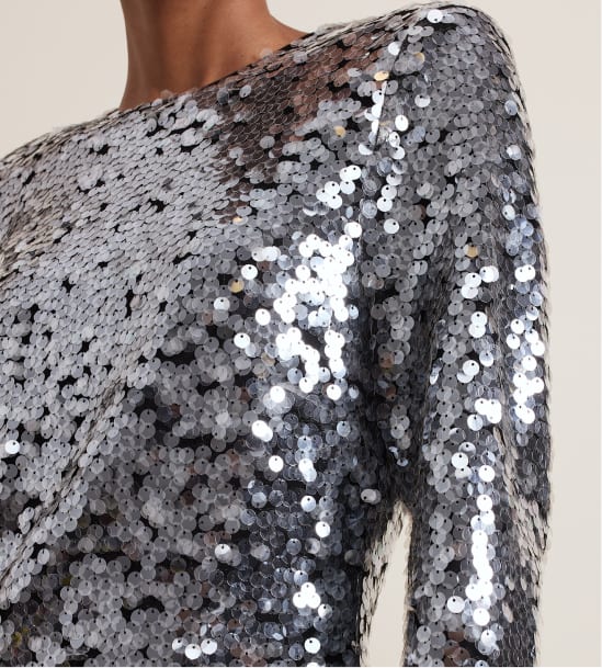 Woman wearing Phase Eight sequin dress