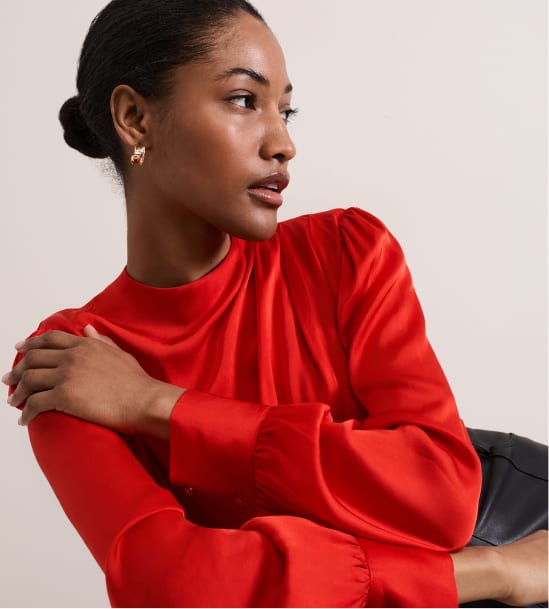 Woman wearing Phase Eight red top