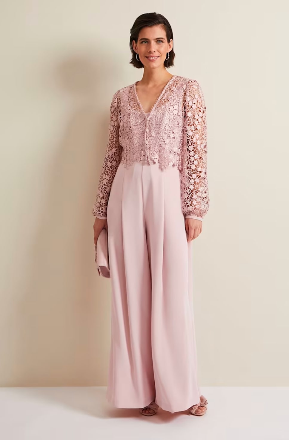 Woman wearing Phase Eight Mariposa Pale Pink Lace Jumpsuit