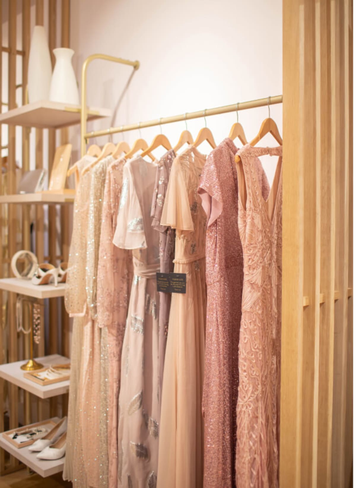 Occasion dresses on a rail in store