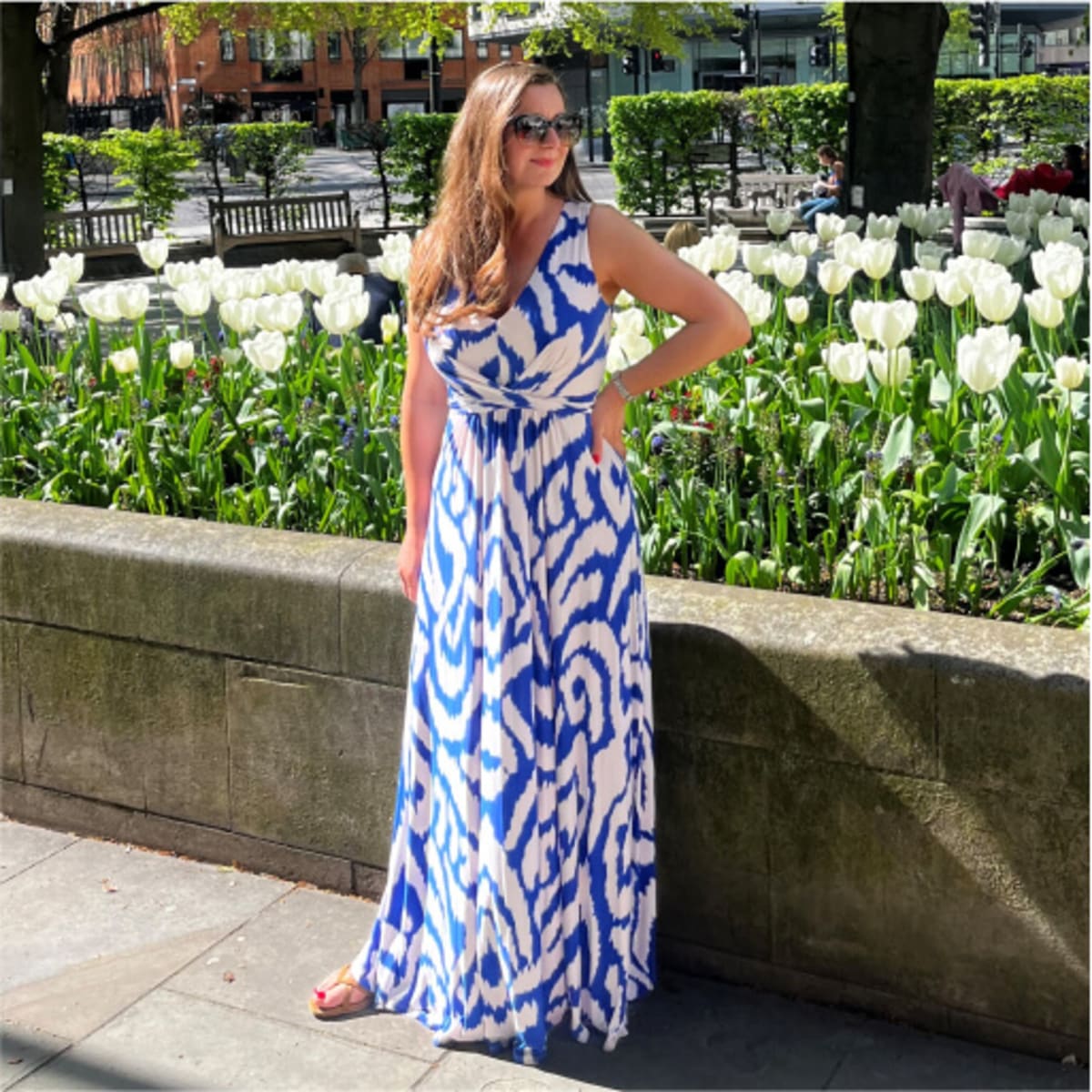 Woman wearing blue and white abstract print dress