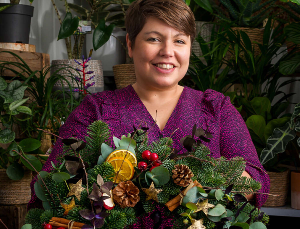 Woman holding a christmas wreath