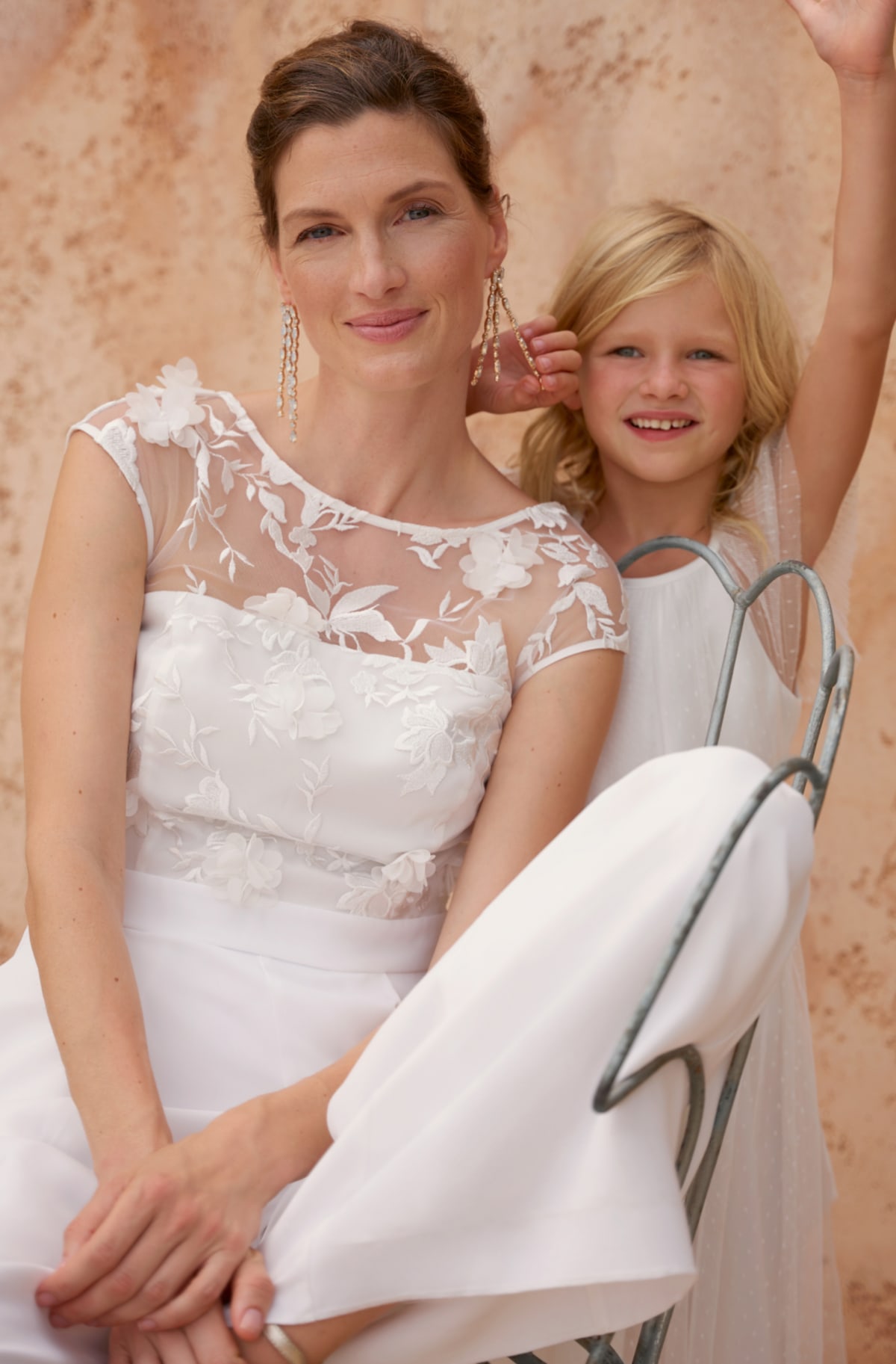Woman wearing Phase Eight Poppy Wedding Dress
