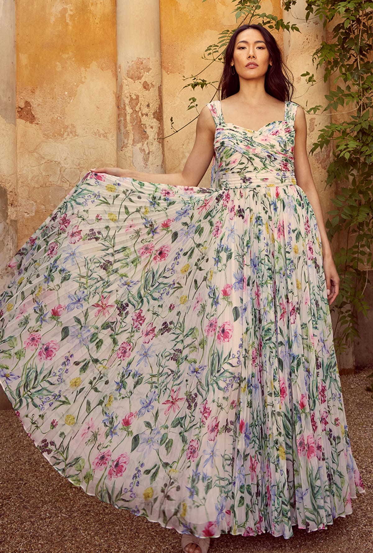 Woman wearing Phase Eight Gretel floral pleated maxi dress