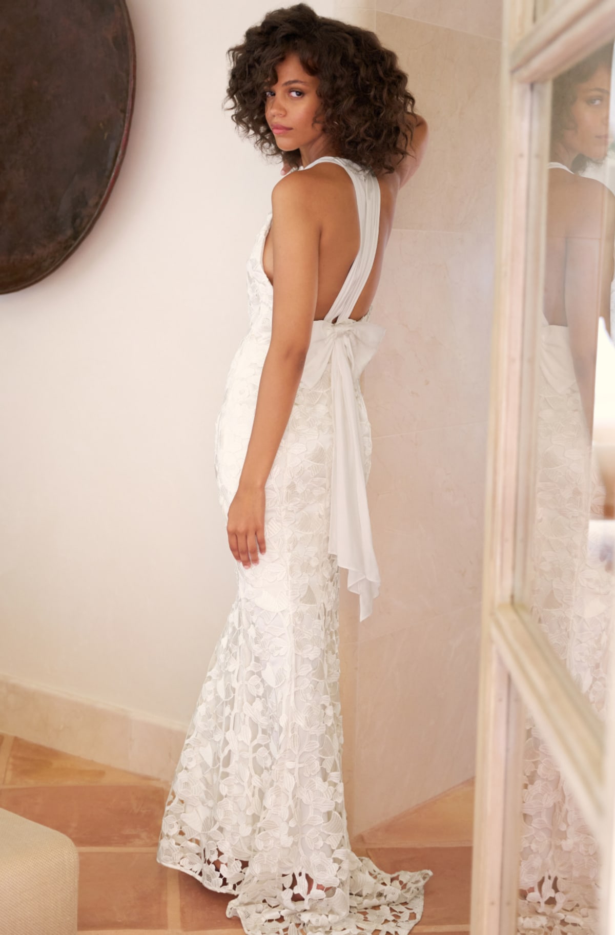 Woman wearing Phase Eight Olivia Lace Wedding Dress