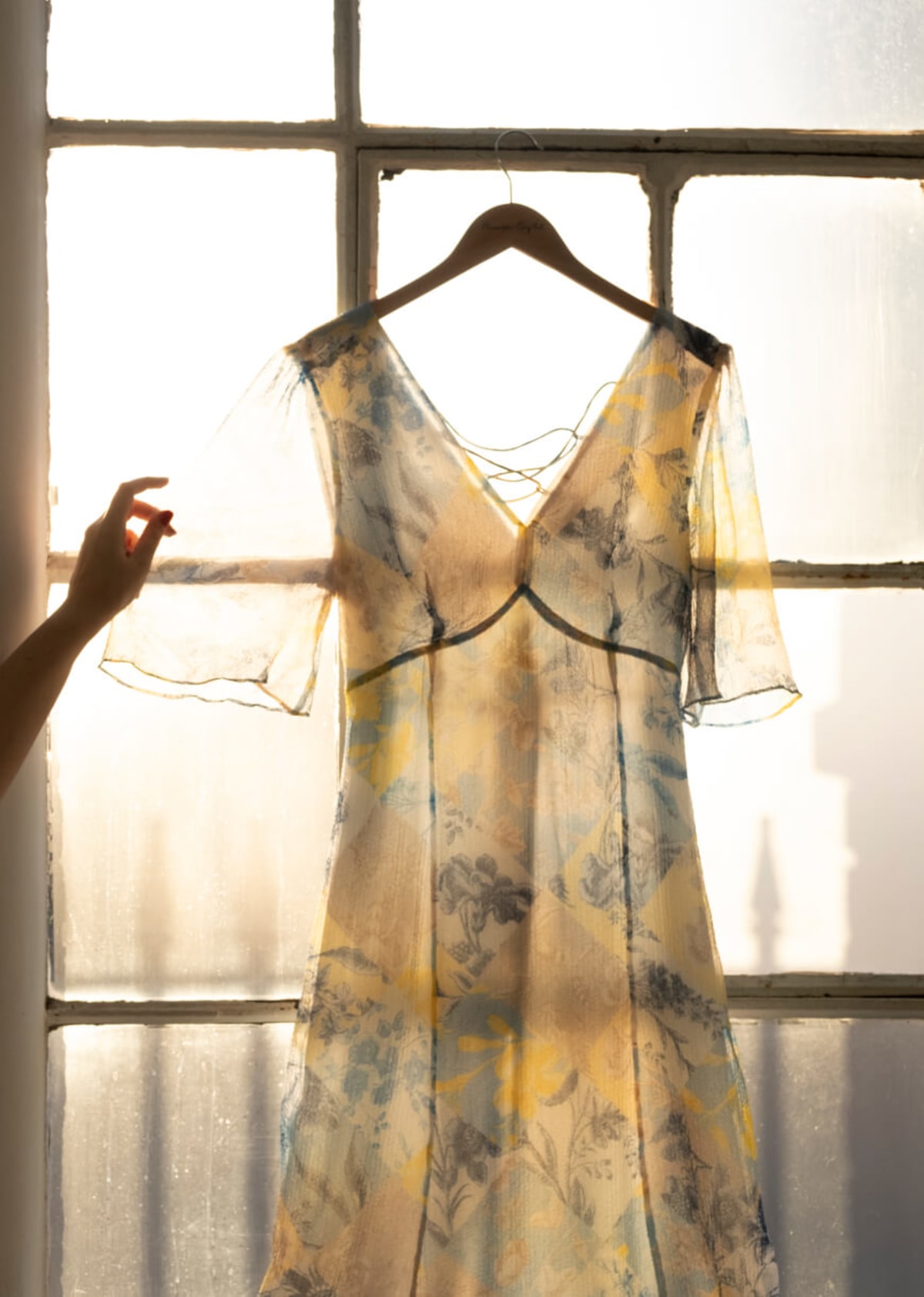 Patchwork print dress on a hanger