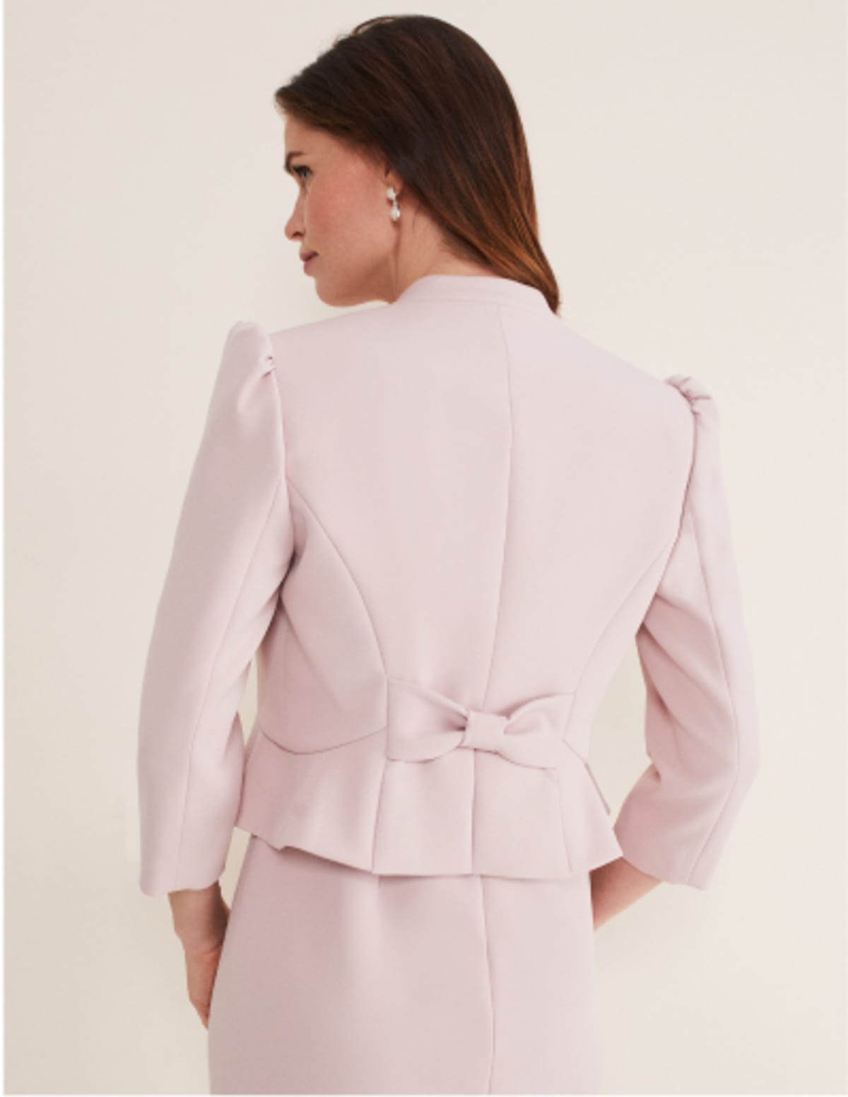 Woman wearing Phase Eight Isabella Bow Jacket