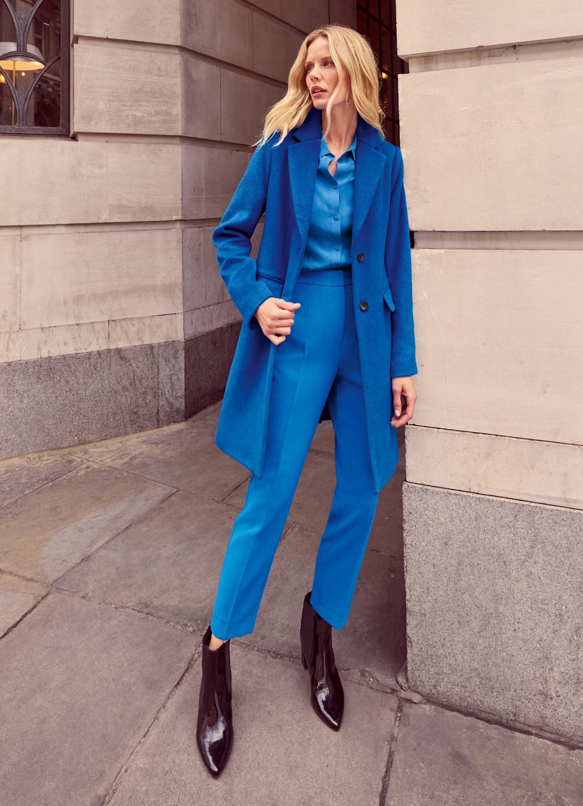 Woman wearing Phase Eight blue suit