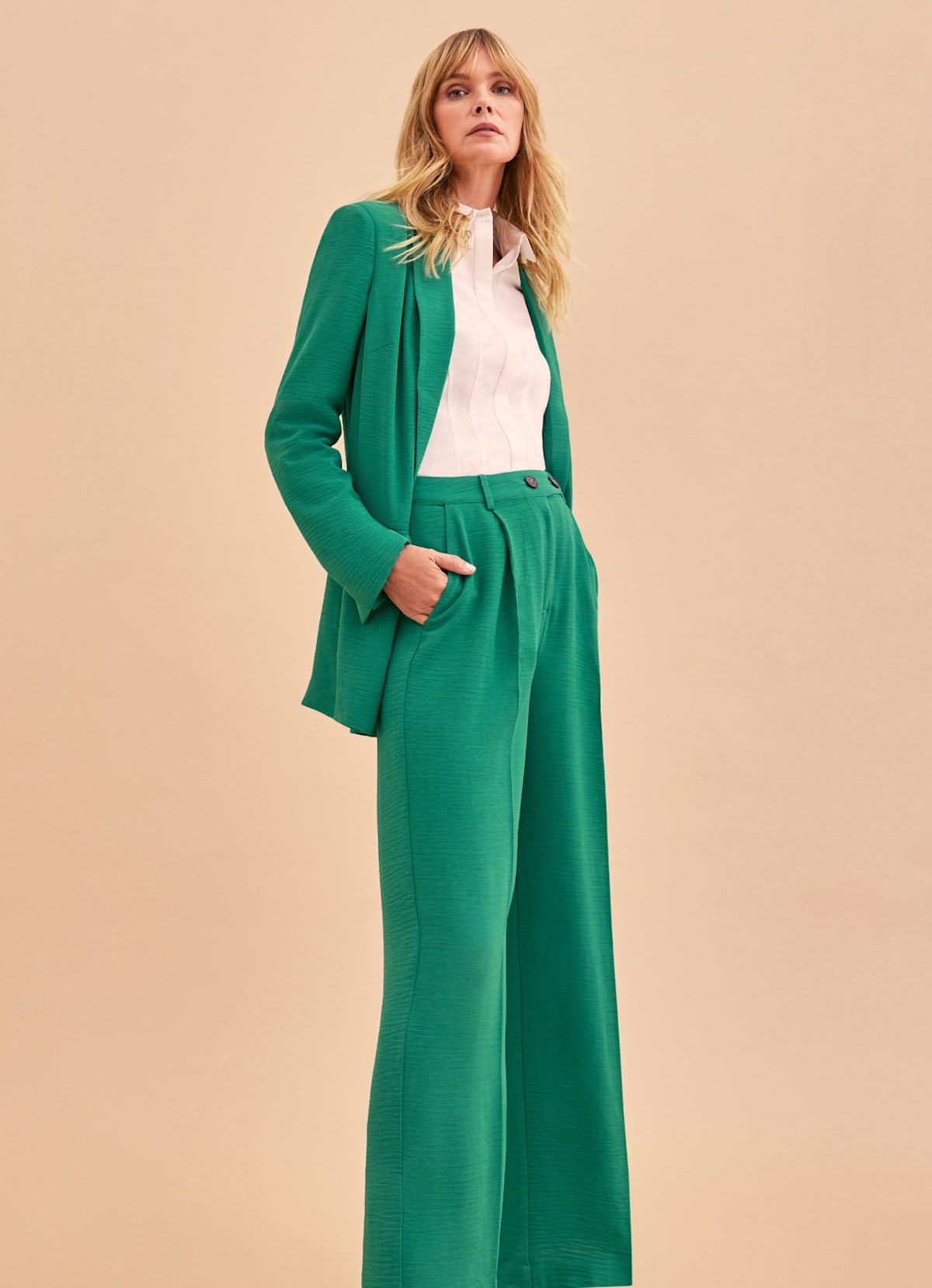 Woman wearing Phase Eight green suit