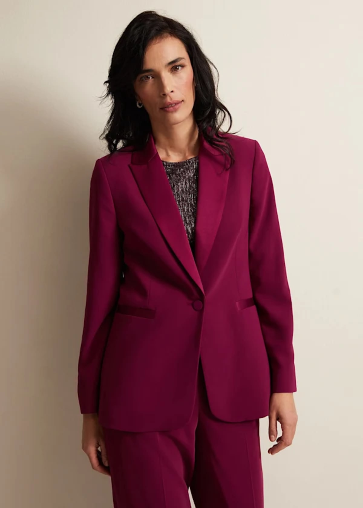 Woman wearing Phase Eight burgundy suit