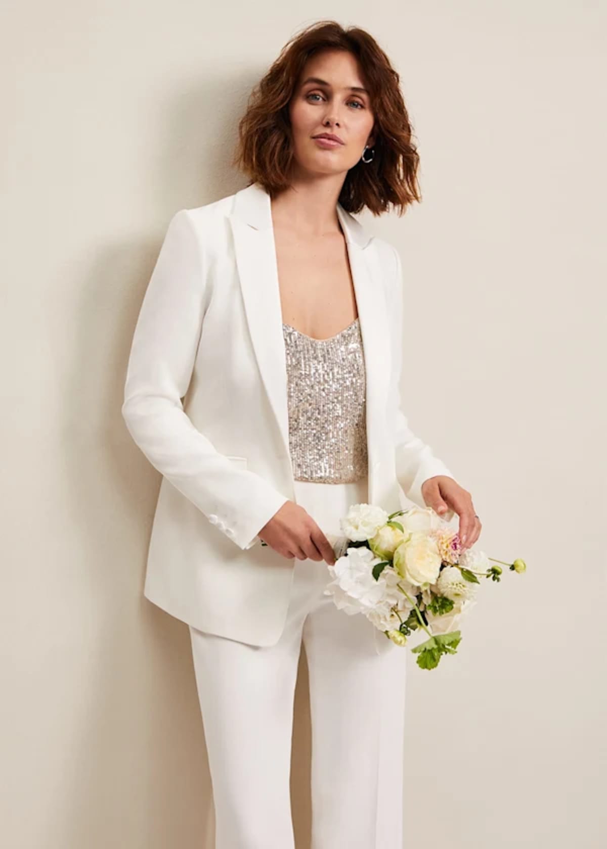 Woman wearing Phase Eight white suit
