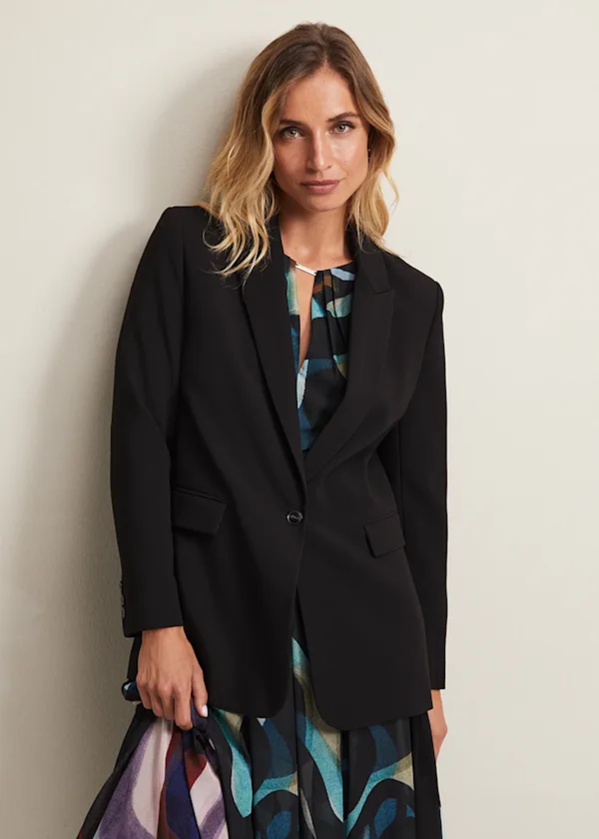 Woman wearing Phase Eight black suit jacket