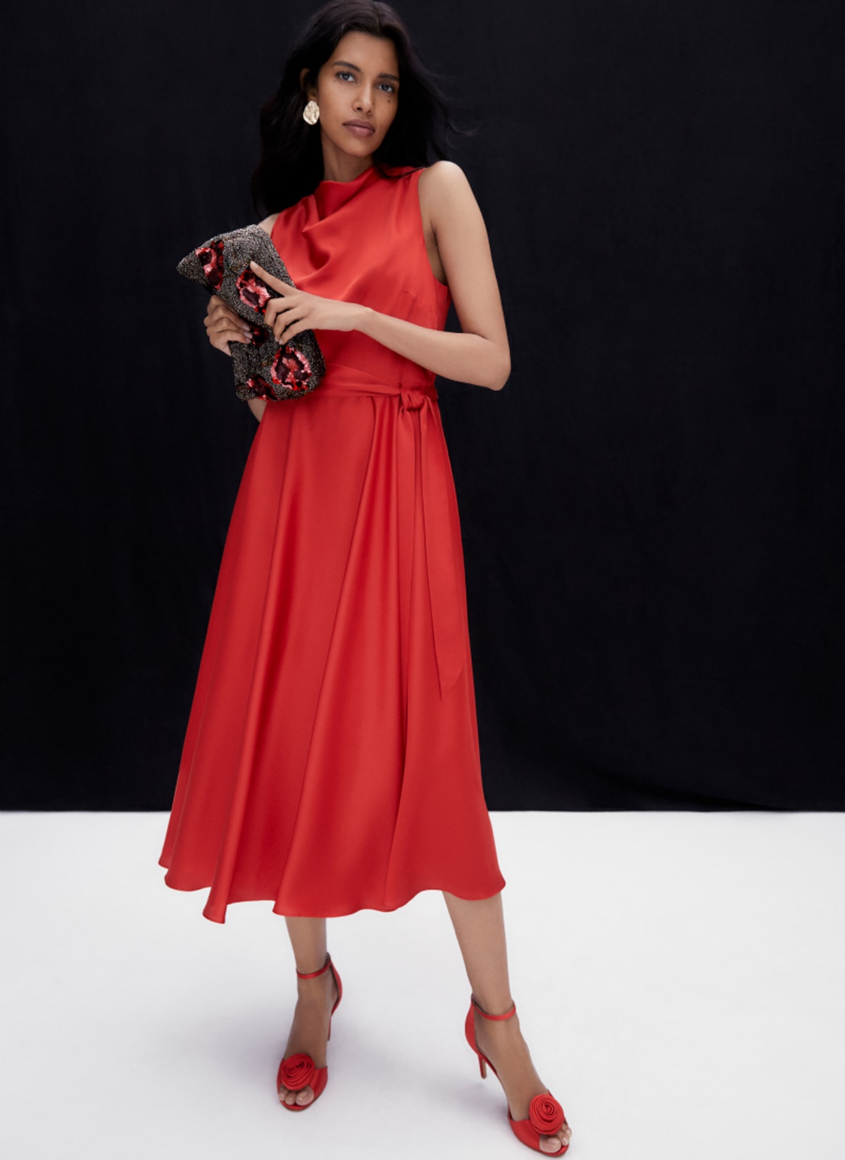 Woman wearing Phase Eight red dress