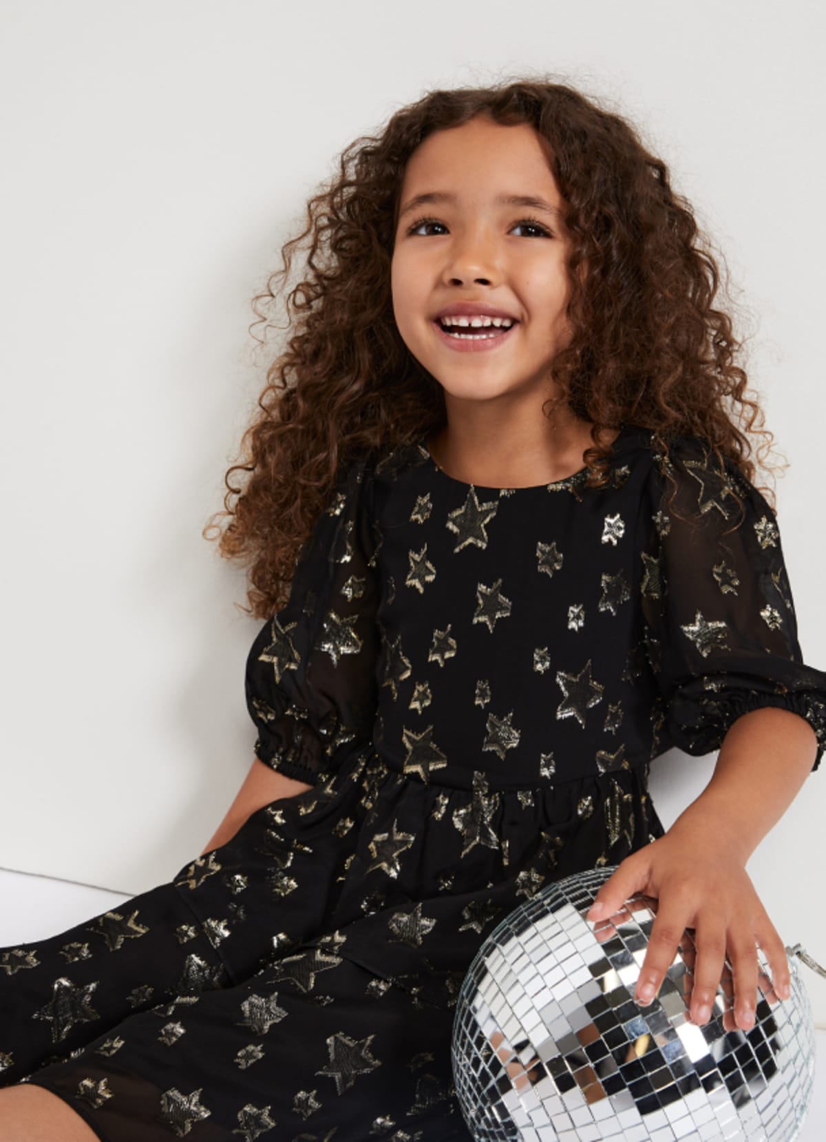 Girl in Phase Eight party dress