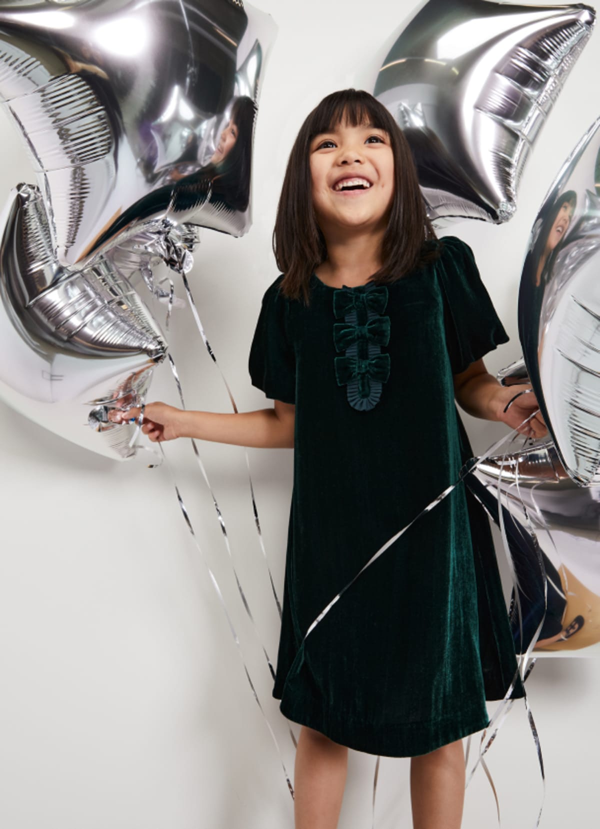 Girl in Phase Eight party dress
