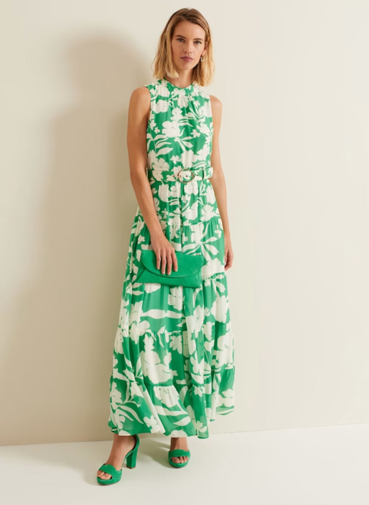Woman wearing Phase Eight green leaf print occasion dress