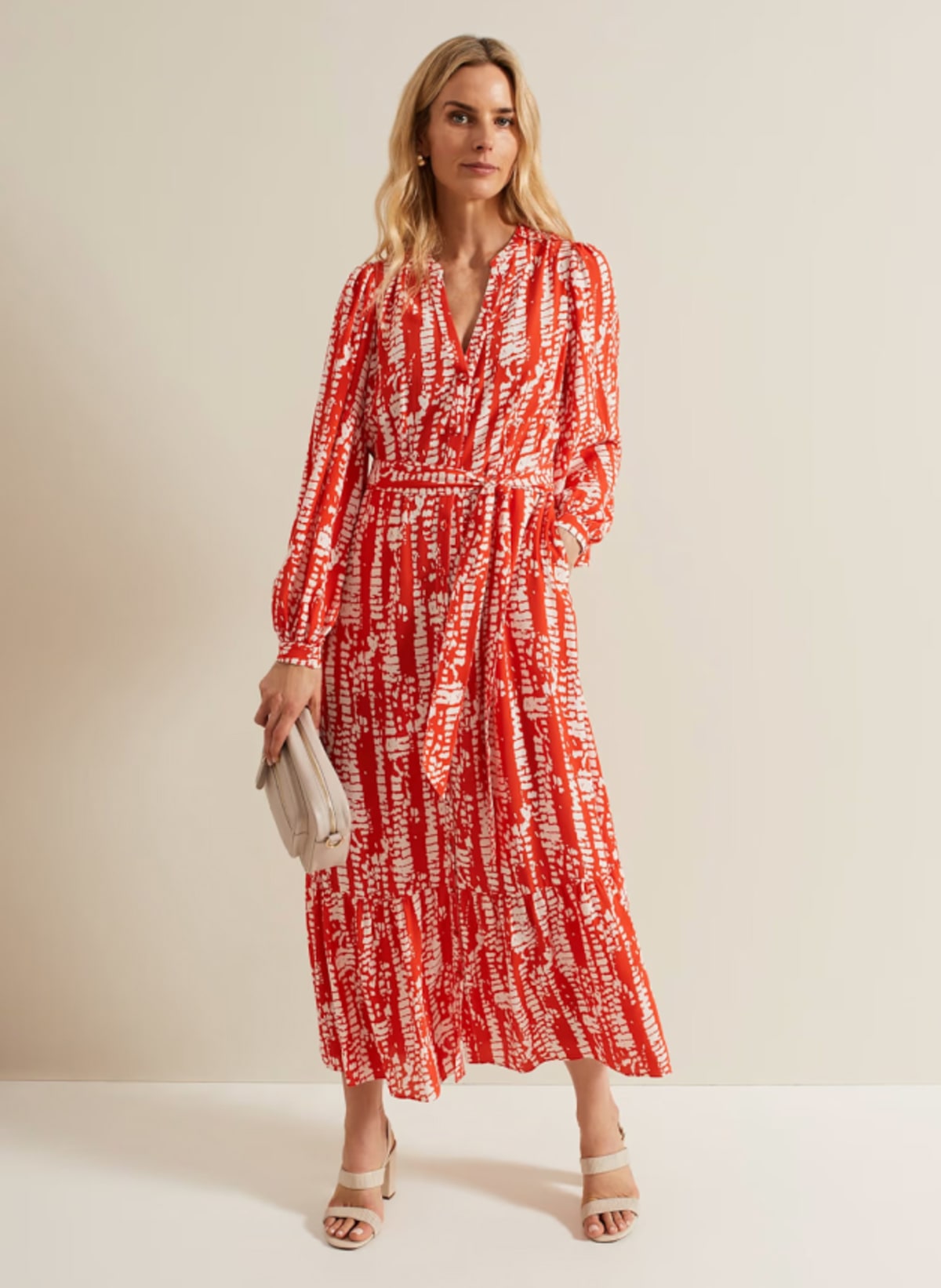 Woman wearing Phase Eight red abstract print dress