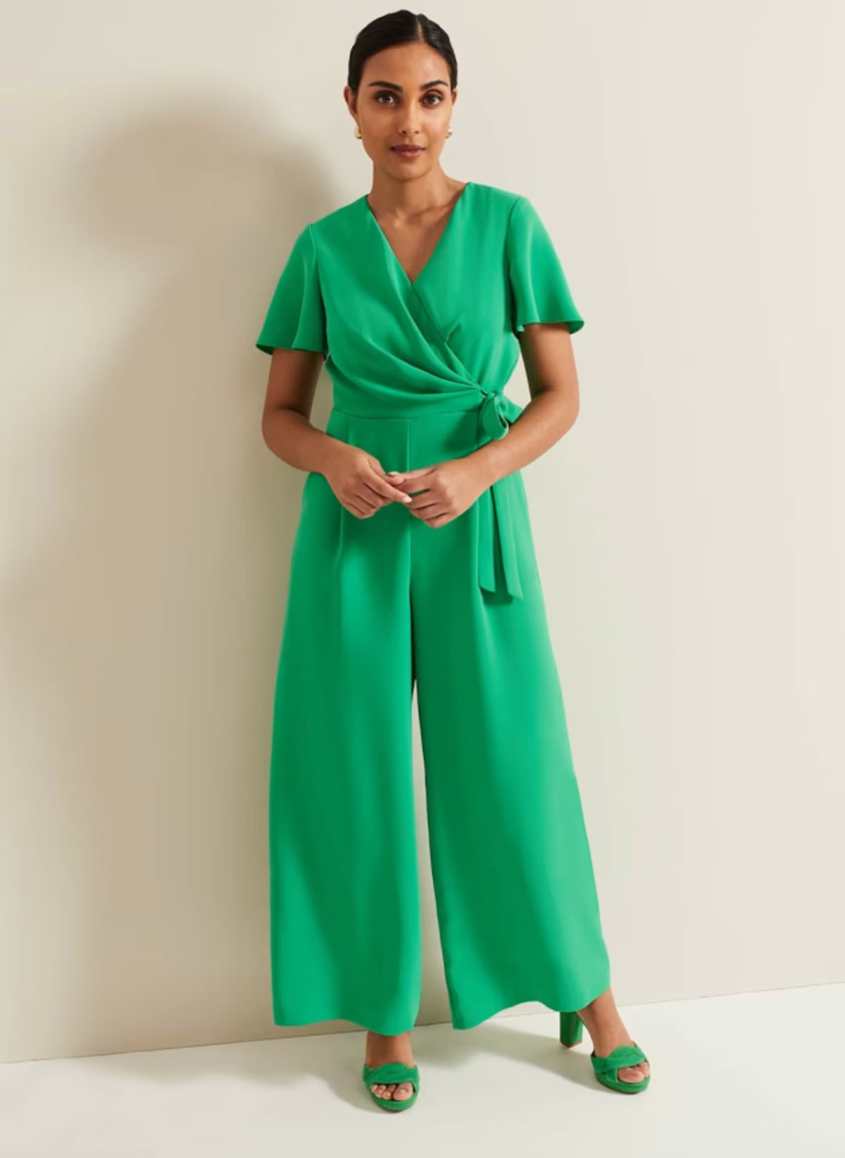 Woman wearing Phase Eight green wide leg jumpsuit
