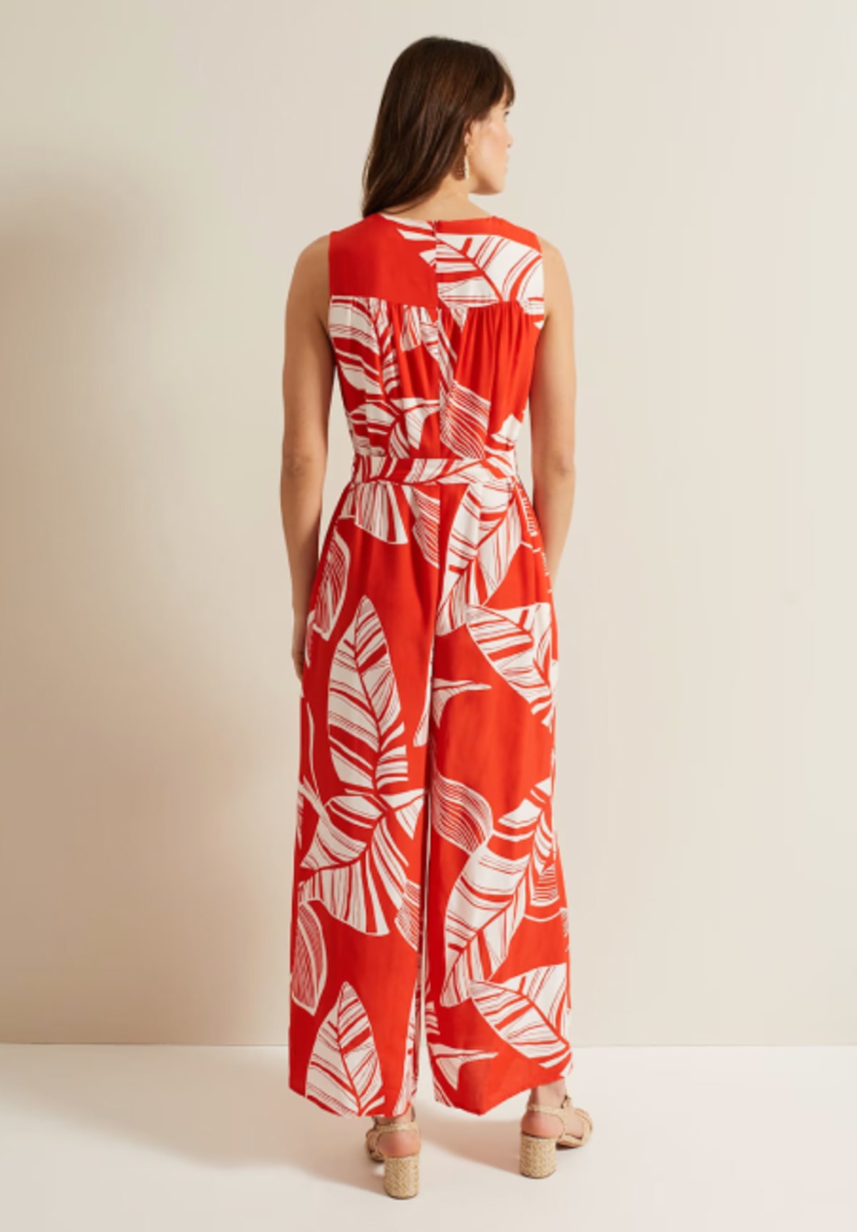 Woman wearing Phase Eight red printed jumpsuit