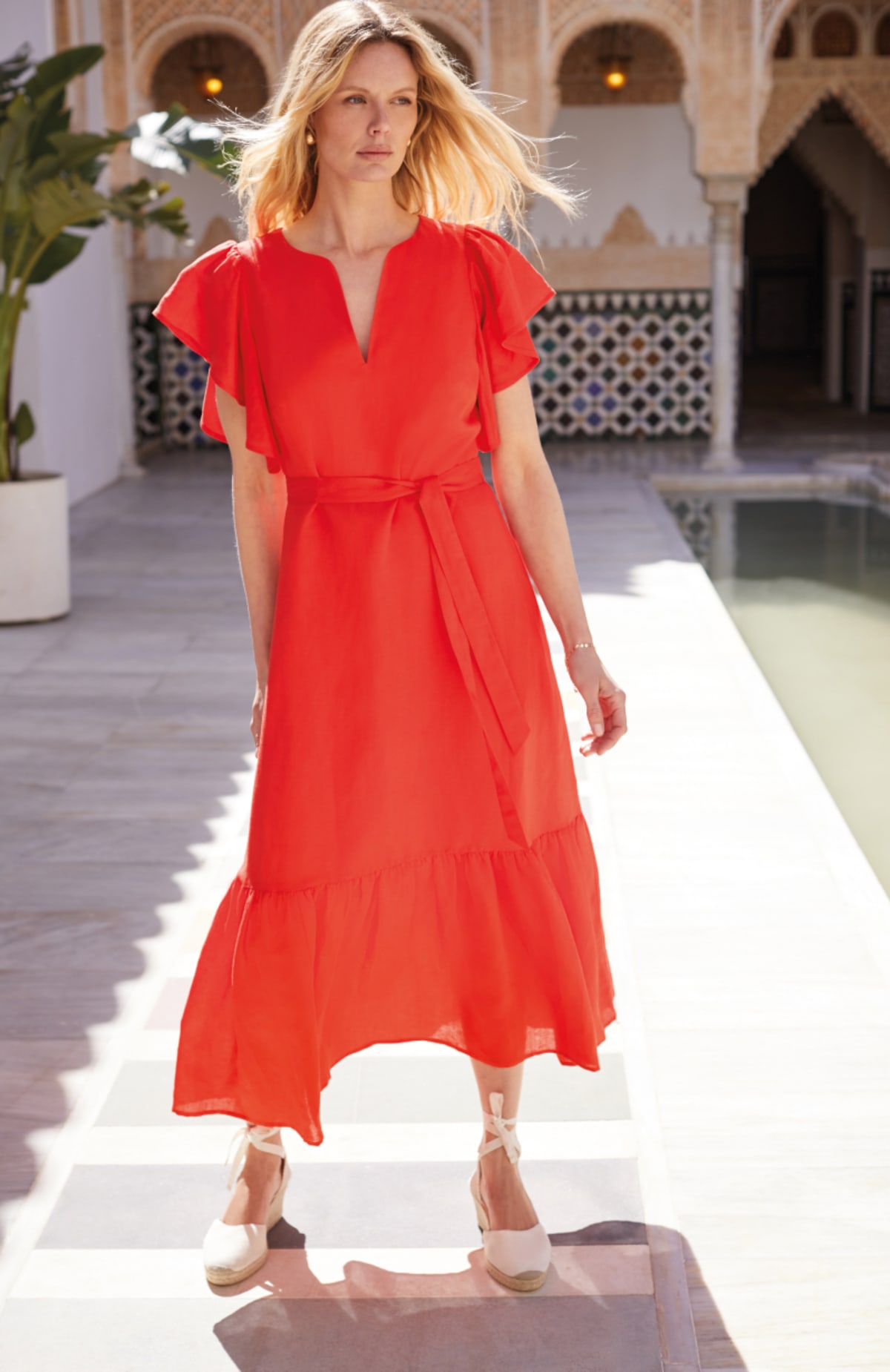 Woman wearing Phase Eight red linen dress