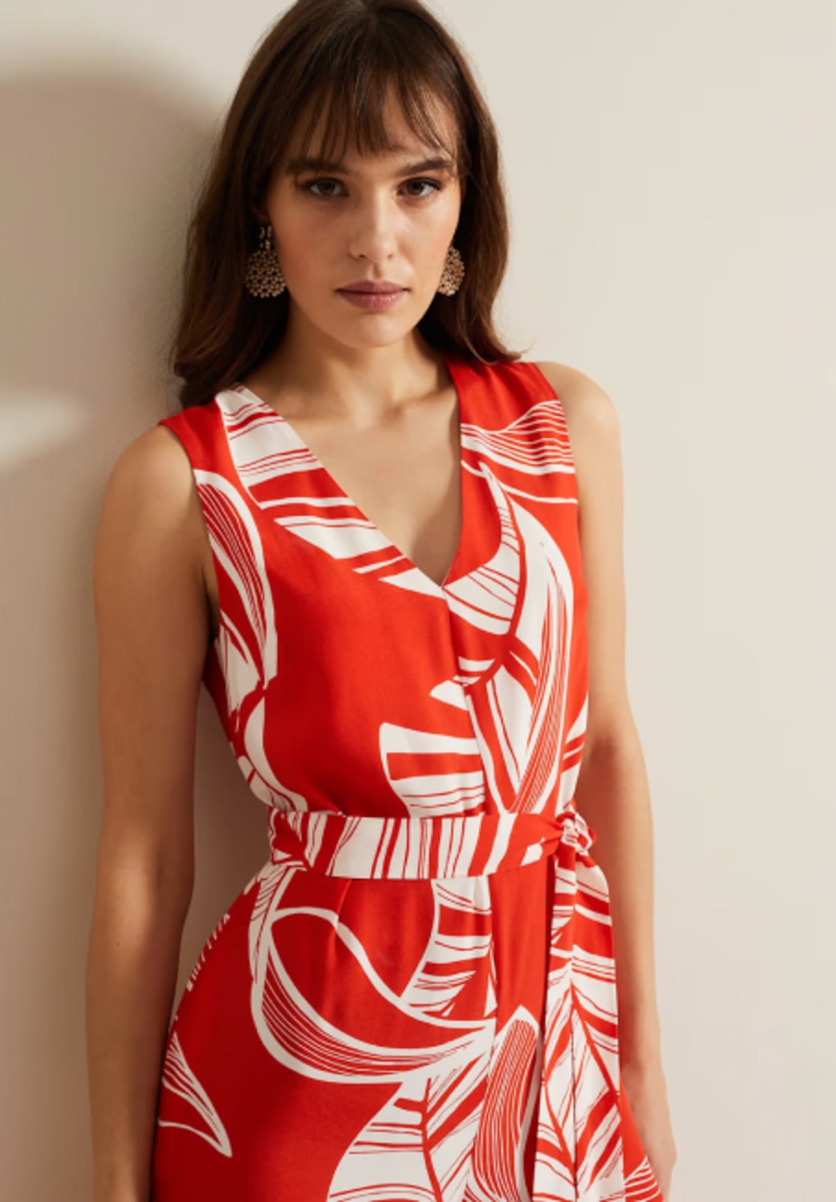 Woman wearing Phase Eight red printed jumpsuit