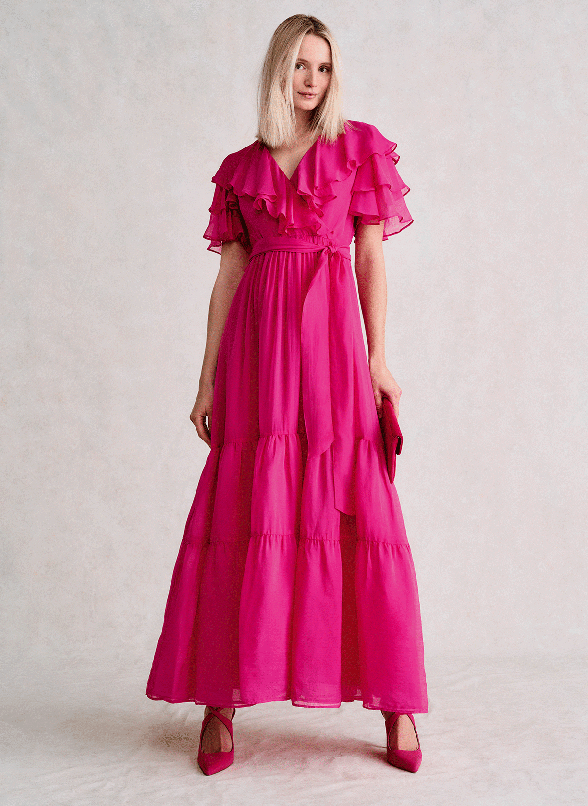 Woman wearing Phase Eight pink maxi dress
