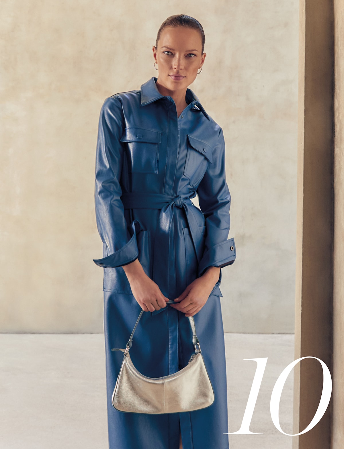 Woman wearing Phase Eight blue leather dress