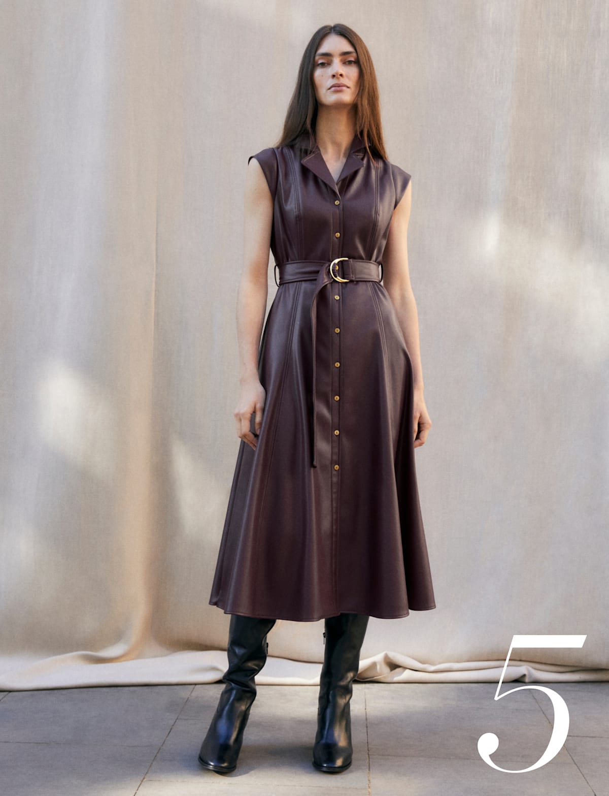 Woman wearing Phase Eight burgundy leather dress