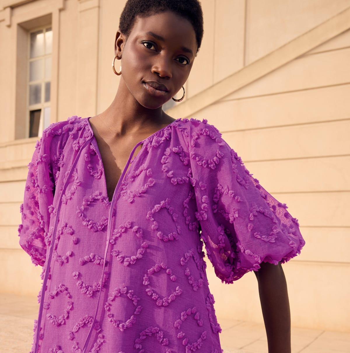 Woman wearing Phase Eight printed dress