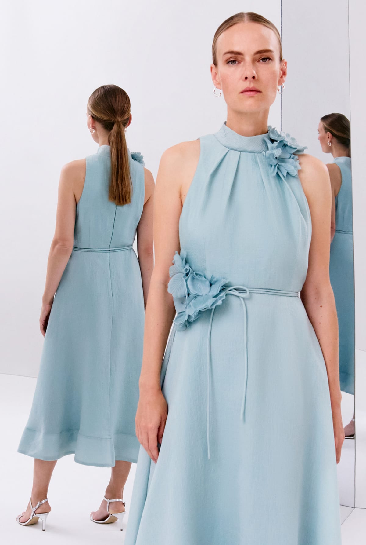 Woman wearing Phase Eight event dress