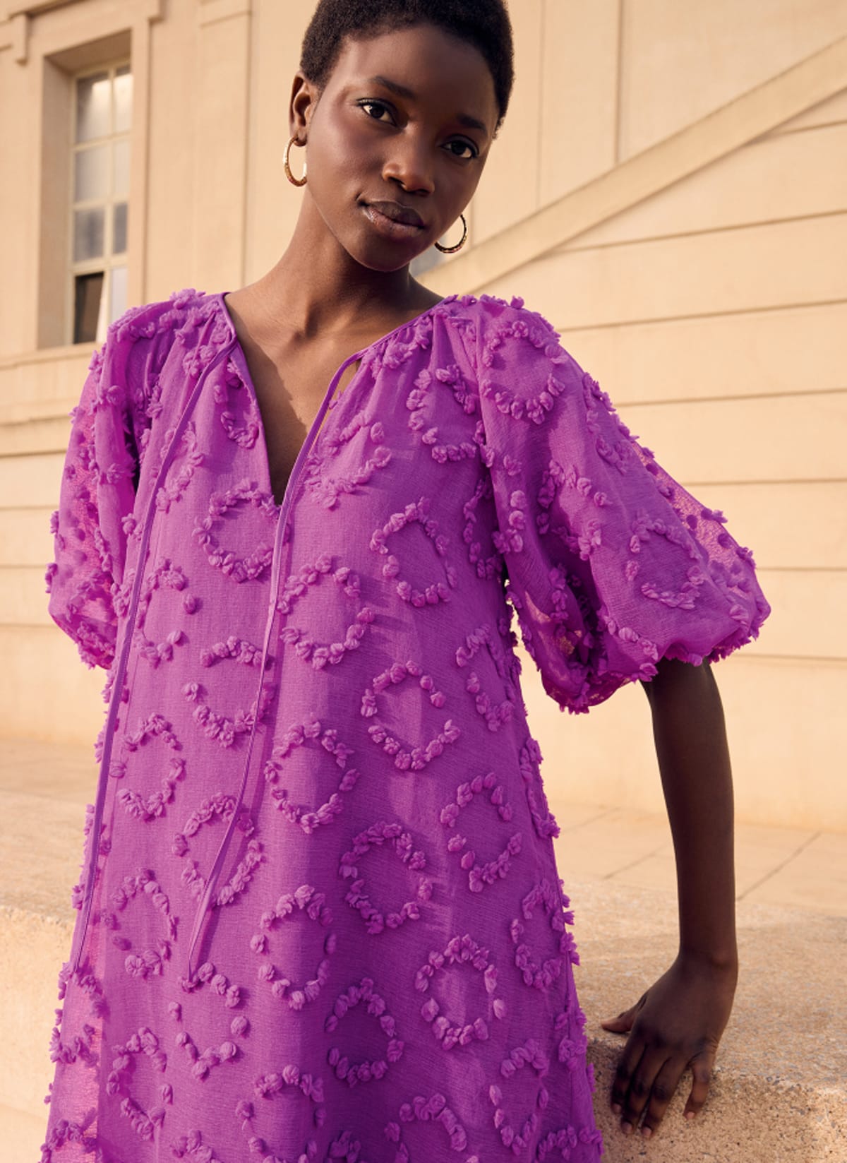 Woman wearing Phase Eight printed dress
