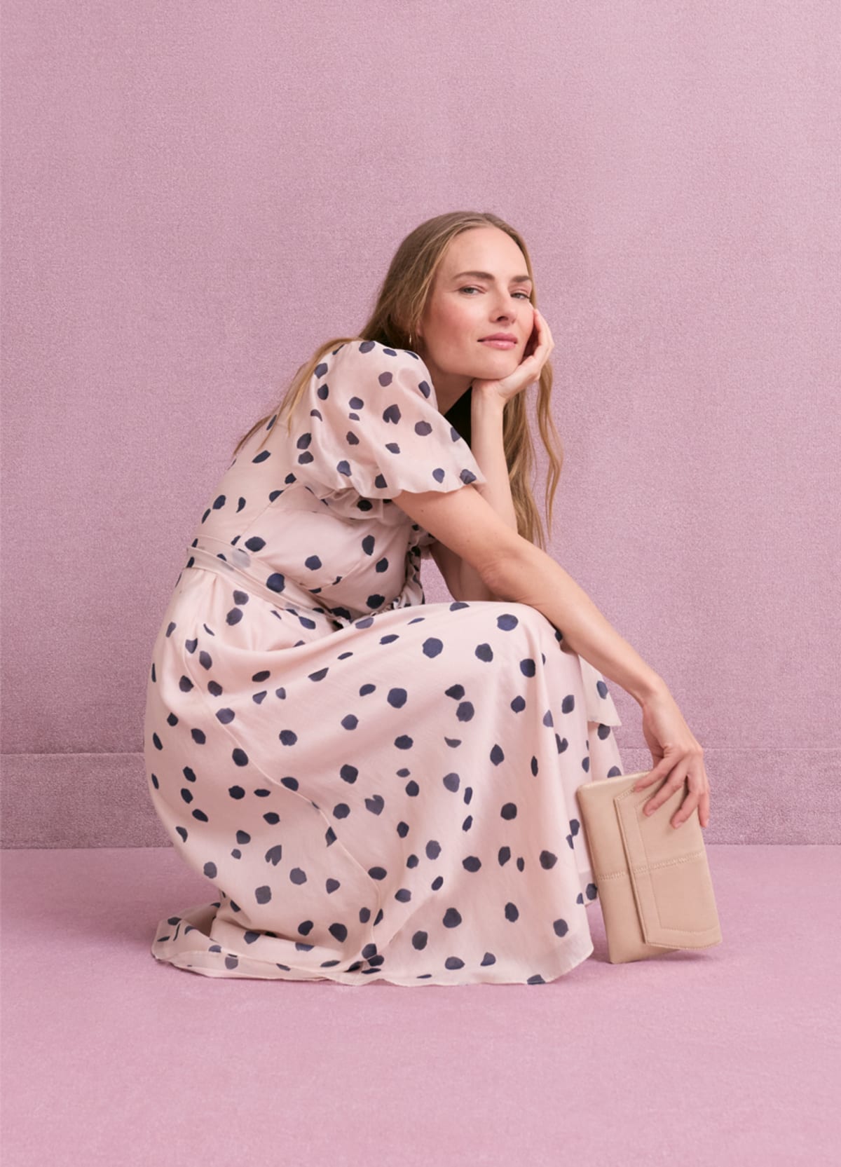 Women wearing Phase Eight pink polka dot dress