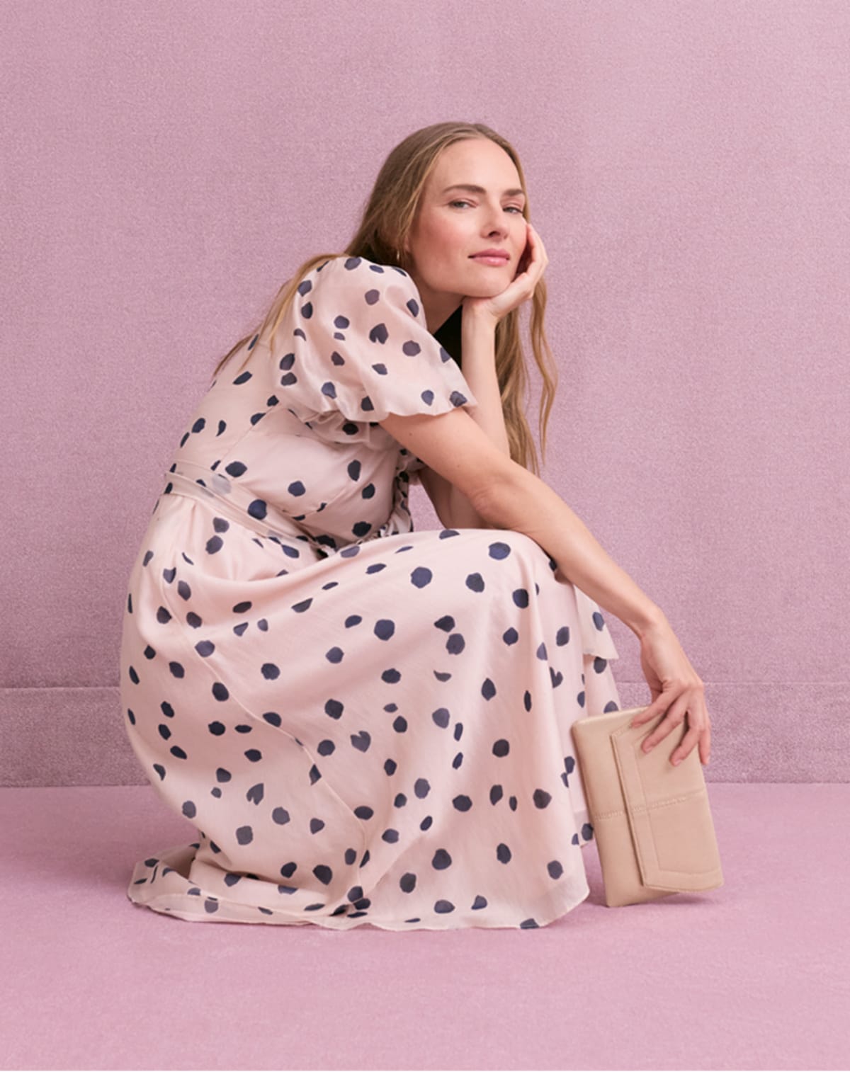 Women wearing Phase Eight pink polka dot dress
