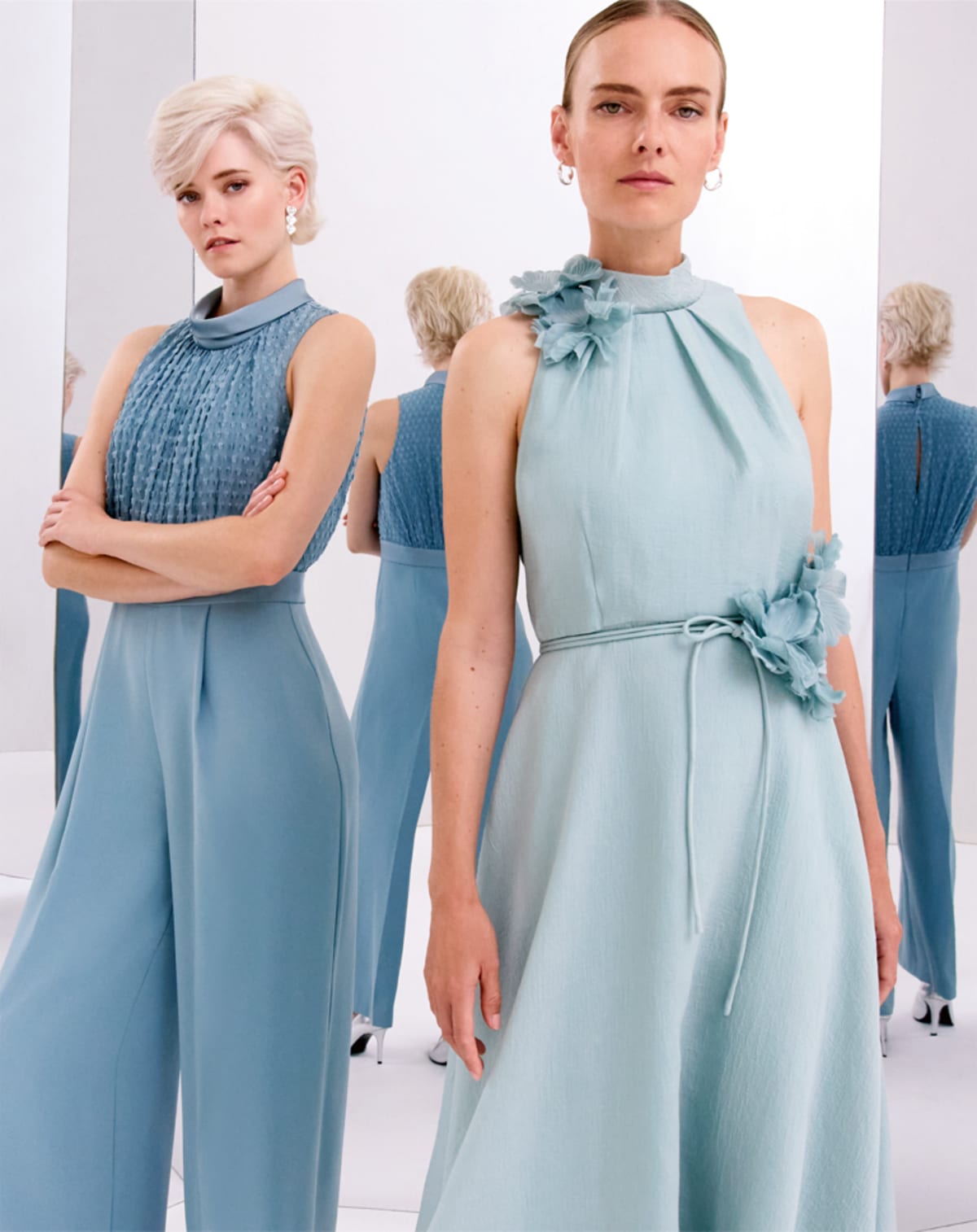 Women wearing Phase Eight blue dress and jumpsuit