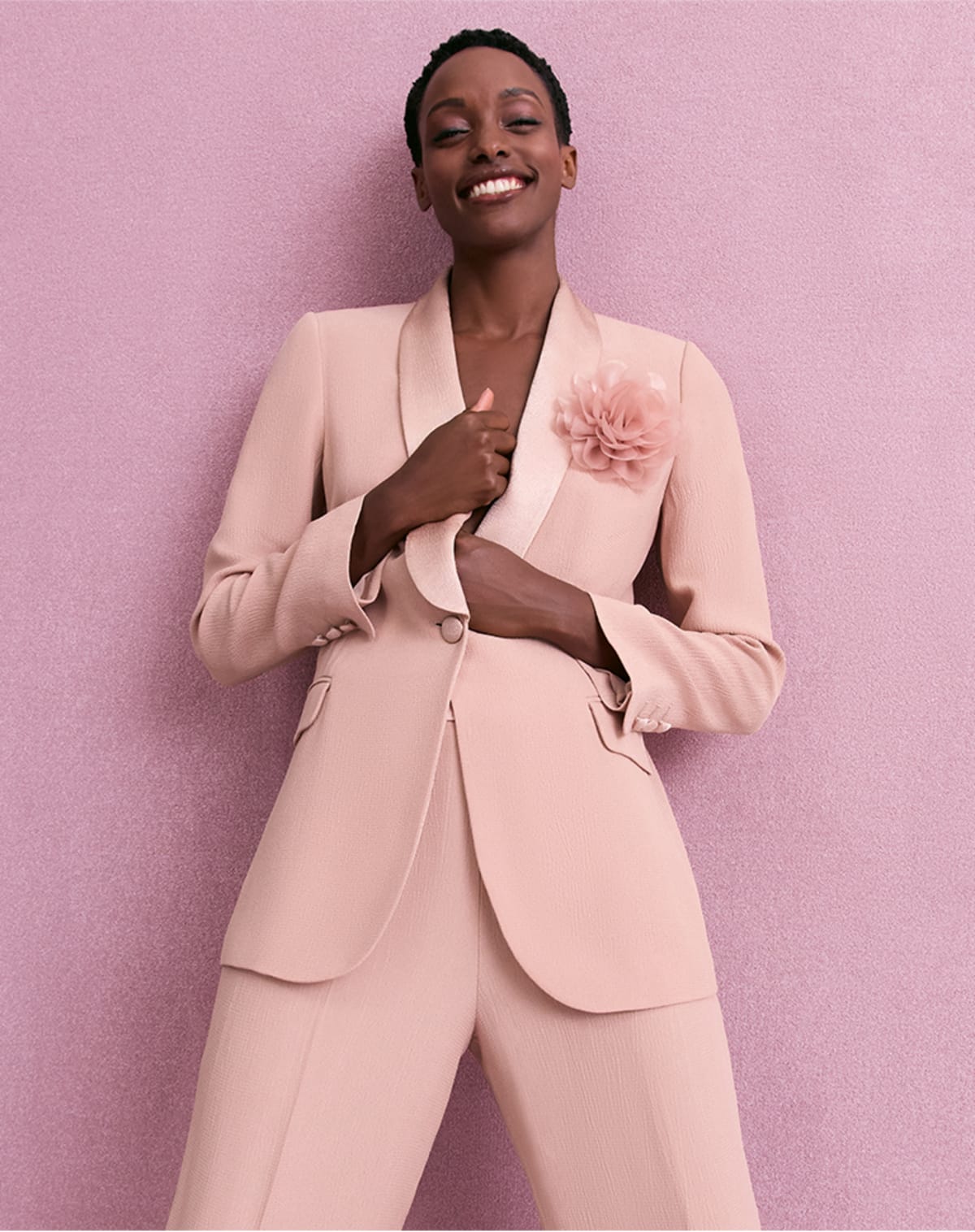 Woman wearing pink Phase Eight suit