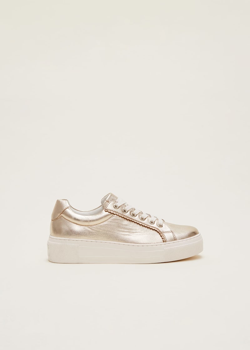 Metallic gold trainers store